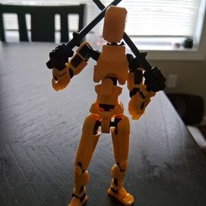 JustFab Yellow Action Figure